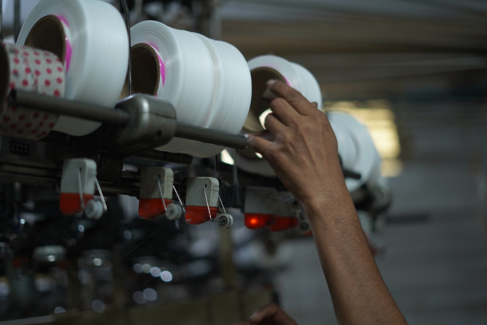 Worker attending to the yarn feed